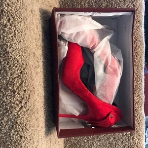 Pointed toed red heels
